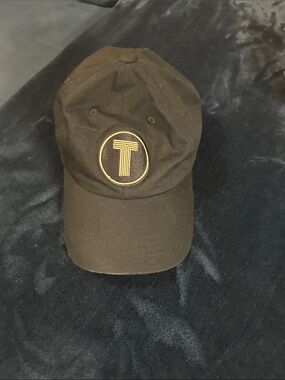 The Classic Black Baseball Cap with Gold 'T' Emblem